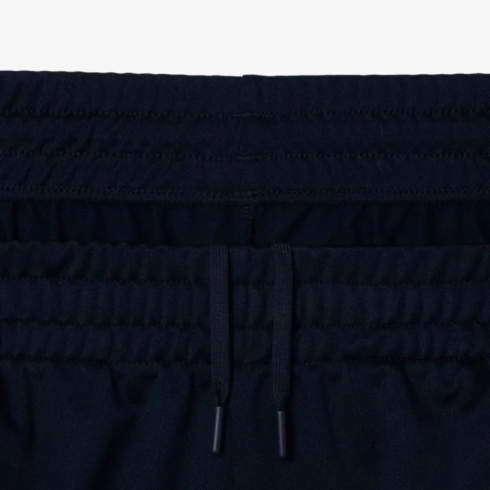 Sweatpants and Trousers Men Lacoste Men039s AbrasionResistant Tennis Sweatpants Navy Blue White 525